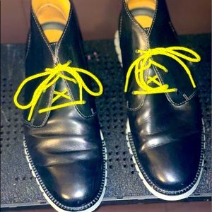 Black leather boots by Cole Haan